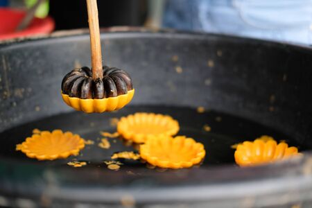 yellow flower candle for making worship merit to buddhaの写真素材