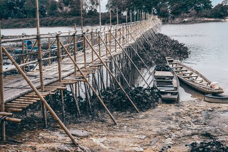 wooden bridge footbridge walkway pathway crossing riverの写真素材