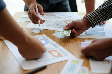 user experience UX designer designing web on smart phone layout. UI planning mobile application....