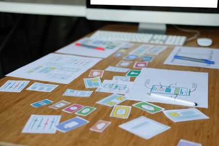 user experience UX designer designing web on smart phone layout. UI planning mobile application. developer work with business prototypeの写真素材