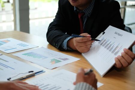 financial adviser discussing with investor. business people have a meeting. businessman working on startup project with co-worker team.の写真素材