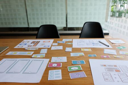 user experience UX designer designing web on smart phone layout. UI planning mobile application. developer work with business prototypeの写真素材