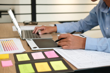 user experience UX designer designing web on smart phone layout. UI planning mobile application....