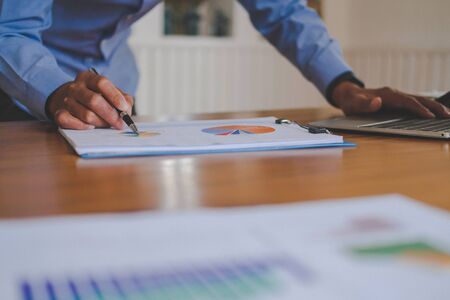 startup businessman working with document at office. man entrepreneur analyze financial data at workplace.の写真素材