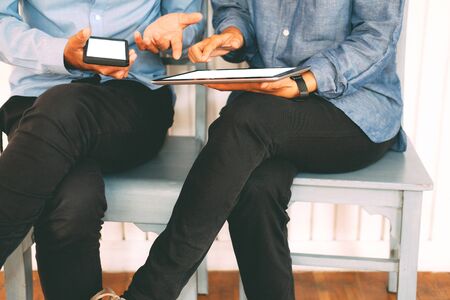 business people discussing using tablet smart mobile phone at workplaceの写真素材