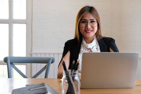 businesswoman using computer. startup woman working with laptop at office.の写真素材