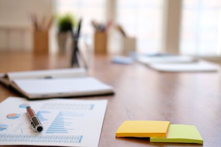 graph chart document on desk table at workplace officeの写真素材