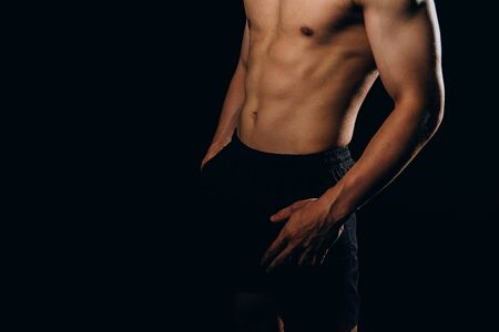 portrait of athletic muscular bodybuilder man with naked torso six pack abs. fitness workout conceptの写真素材