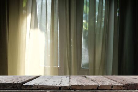 light on yellow see through sheer window curtain at home. transparent fabricの写真素材