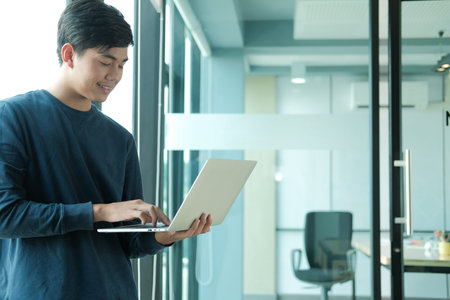 startup male freelancer working with computer at office. man entrepreneur analyzing data at...