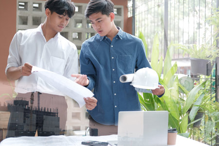 architect engineer working on house blueprint of real estate project at workplace. building...
