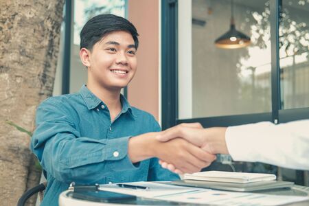 Business people shaking hands after meeting. colleagues handshaking after conference. Greeting deal, teamwork partnership cooperate concept.の写真素材