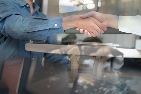 Business people shaking hands after meeting. colleagues handshaking after conference. Greeting deal, teamwork partnership cooperate concept.の写真素材