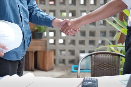 architect shaking hands after meeting. engineer handshaking after conference. Greeting deal, teamwork partnership cooperate concept.の写真素材