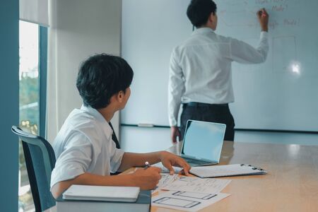 user experience UX designer designing web on smart phone layout. UI planning mobile application. developer work with business prototypeの写真素材