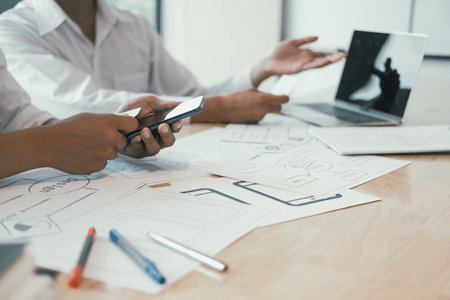 user experience UX designer designing web on smart phone layout. UI planning mobile application....