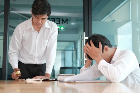 lawyer giving advice to a man. businessman discussing legal legislation at law firm. judge team meeting at courtroomの写真素材