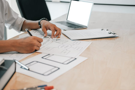 user experience UX designer designing web on smart phone layout. UI planning mobile application....