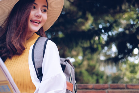 young asian woman traveler tourist with map. journey trip travel conceptの写真素材