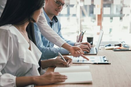 business people discussing on performance revenue in meeting. businessman working with co-worker team. financial adviser analyzing data with investor.の写真素材