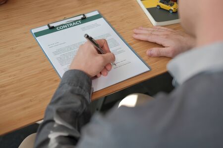 businessman signing mortgage loan contract agreement. buying home conceptの写真素材
