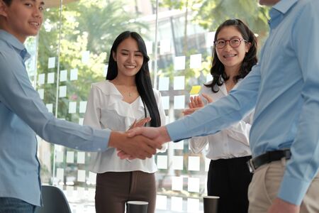businessman shaking hands after meeting. Business people handshaking. Greeting deal, teamwork partnership concept.の写真素材