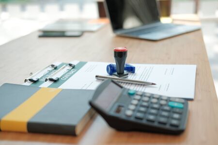 stamper insurance contract document on lawyer broker realtor real estate agent office deskの写真素材