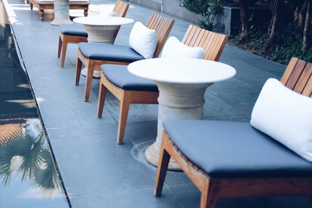 white pillow gray cushion on wooden chair for relaxing outdoor