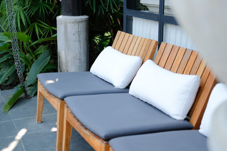 white pillow gray cushion on wooden chair for relaxing outdoor