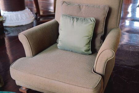 gray pillow on armchair sofa couch in living room. home apartment interiorの写真素材