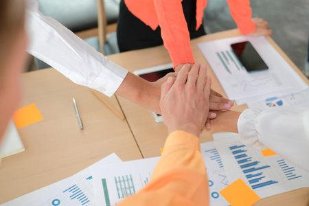 startup man woman joining united hand, business team touching hands together after complete a deal...