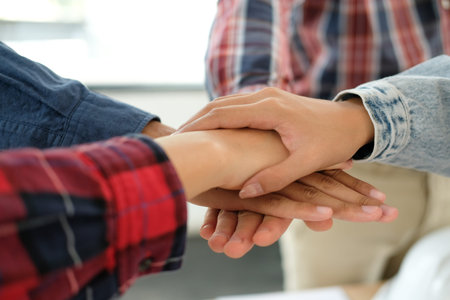 startup man woman joining united hand, business team touching hands together after complete a deal...