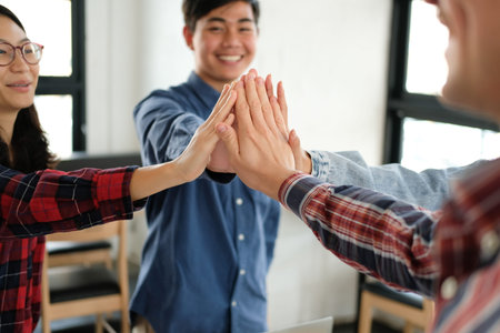 startup man woman joining united hand, business team touching hands together after complete a deal...