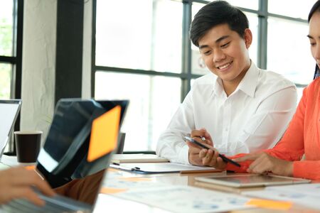 business people discussing on performance revenue in meeting. businessman working with co-worker team. financial adviser analyzing data with investor.の写真素材