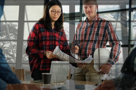 architect engineer interior designer team working discussing on house blueprint of real estate...