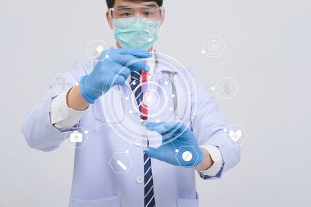 doctor physician practitioner with medicine syringe vial ampule. medical injection & needle vaccination equipmentの写真素材