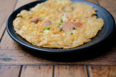 Pan-fried crispy mussel pancake with eggs. oyster fried in egg batterの写真素材