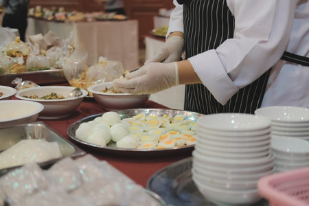 chef cutting boiled egg at restaurant