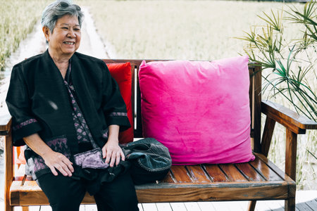 asian elderly woman elder  resting relaxing outdoors. senior leisure lifestyle