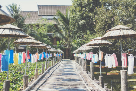 wooden bamboo bridge decorating with colorful fabric lanternの写真素材