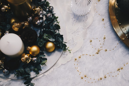 green leaves and christmas balls. festive ornament decoration. candle, conifer coneの写真素材