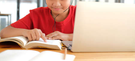 asian boy student studying learning lesson online. remote meeting distance education at homeの写真素材