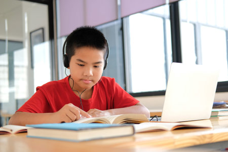 asian boy student studying learning lesson online. remote meeting distance education at home