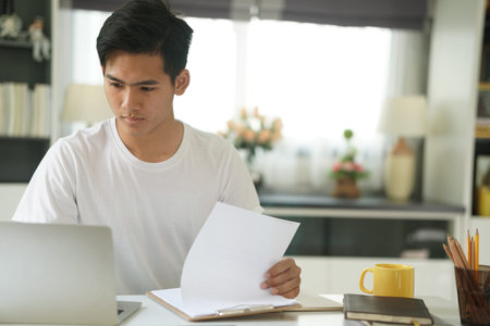 asian young teenage student man teenager entrepreneur working with computer studying learning online...