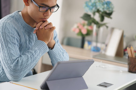 asian young teenage student man teenager entrepreneur working with tablet studying learning online...