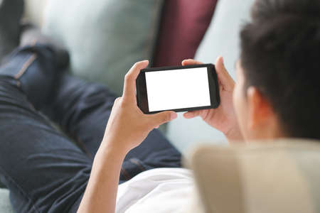 hand holdng smart mobile smartphone with white blank screenの写真素材