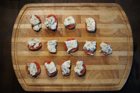 tomatoes with farmer paneer cottage cheese. vegetarian meal snack appetizer.の写真素材