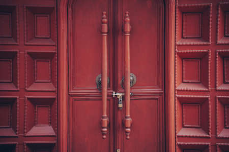 brown wooden door entrance doorknob handle wall for backgroundの写真素材