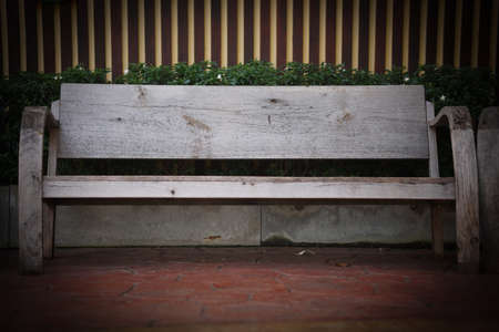 wooden bench seat chair in the garden parkの写真素材