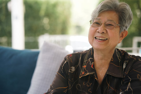 old elderly elder woman resting relaxing in garden